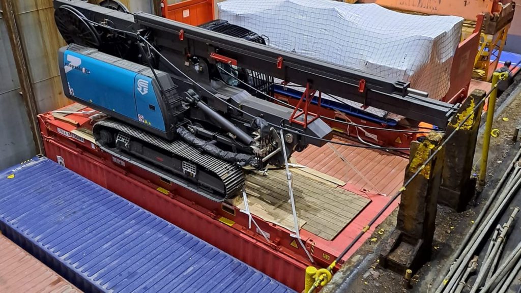 A Casagrande B250 driller cabin secured to a platform inside the cargo hold.