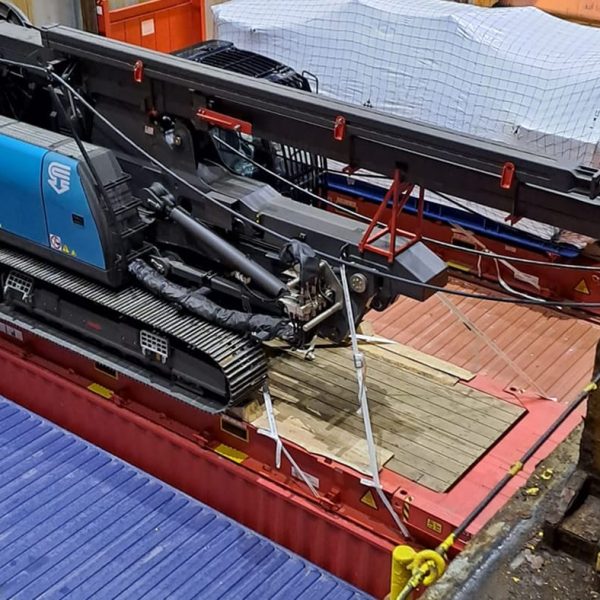 A Casagrande B250 driller cabin secured to a platform inside the cargo hold.