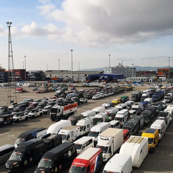 Rows of hundreds of rally support vans and trucks organized in the port terminal.