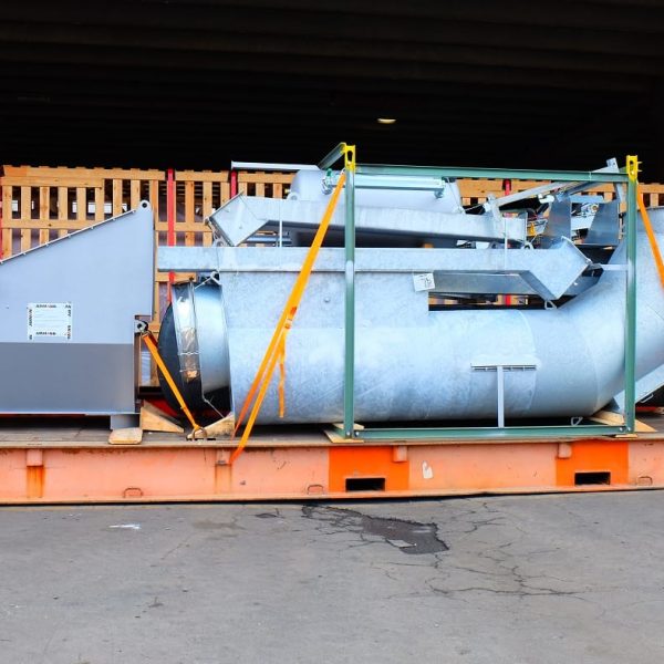 Large galvanized steel Ammann plant components secured on a Messina Line roll-trailer.