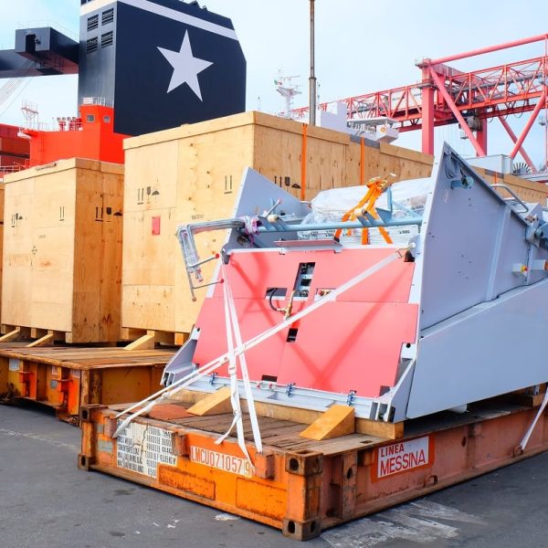 Ammann plant structural parts and large wooden crates ready for loading at the port terminal.